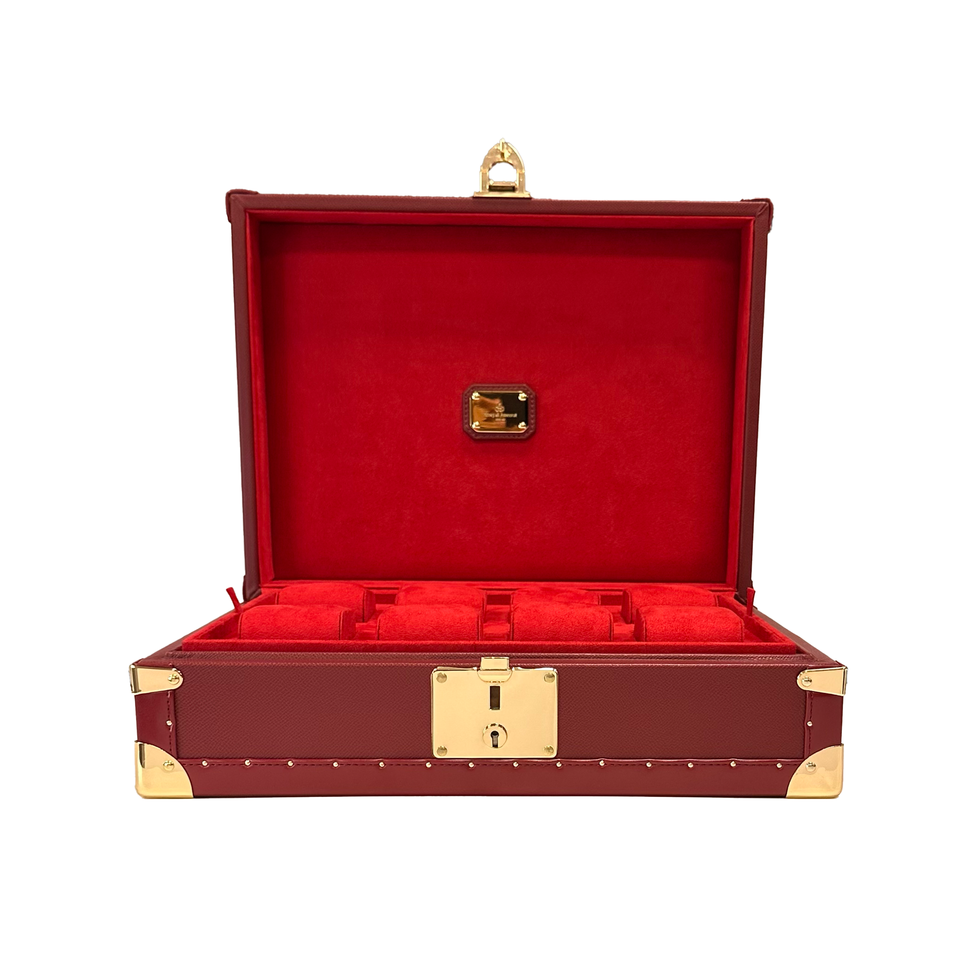 A red leather watch case with golden brass corners and a lock.