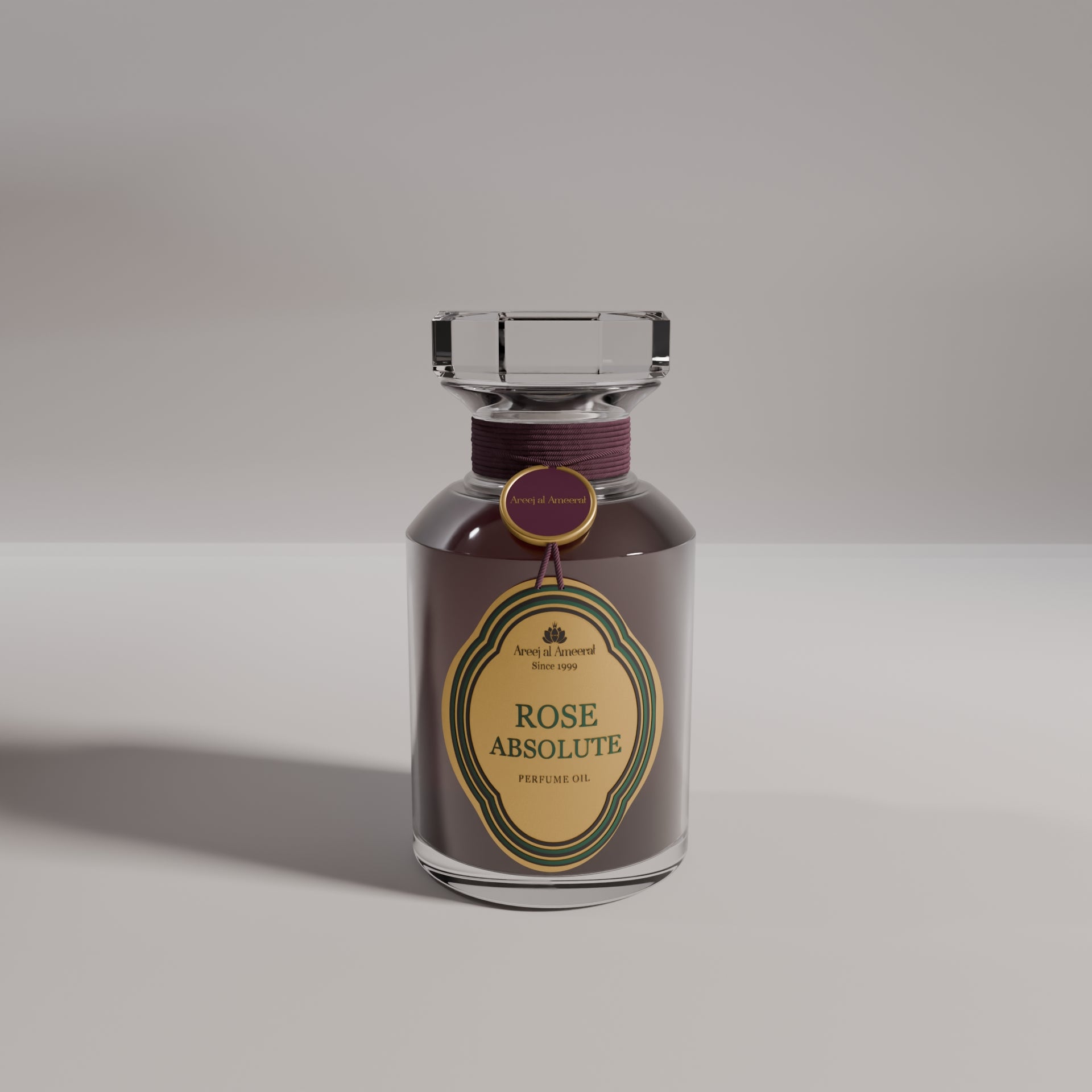 A bottle of Areej Almeerat Rose Absolute perfume with a dark, velvety liquid visible and a label that reads 'ROSE ABSOLUTE'.